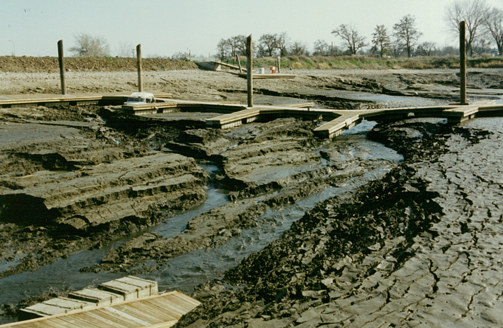 What are the effects of sediment buildup in a river basin?