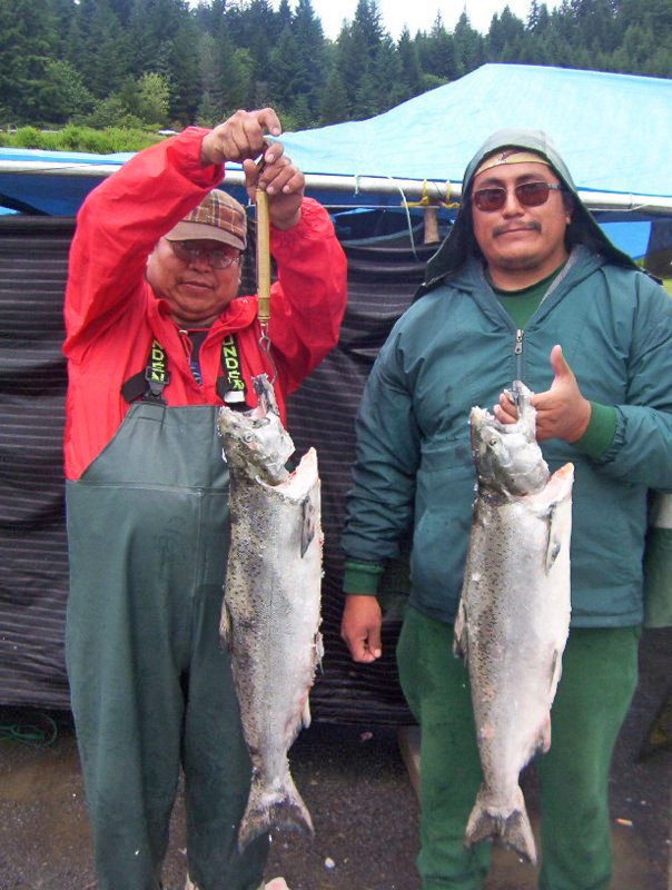 Native American fisherman with salmon catch